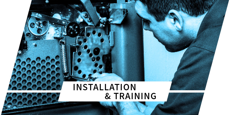 man fixing gears on packaging equipment with text saying installation and training on top